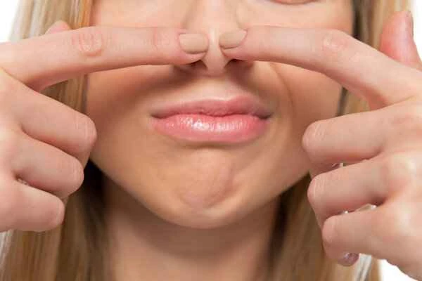 What causes nasal bridge scars to flatten?